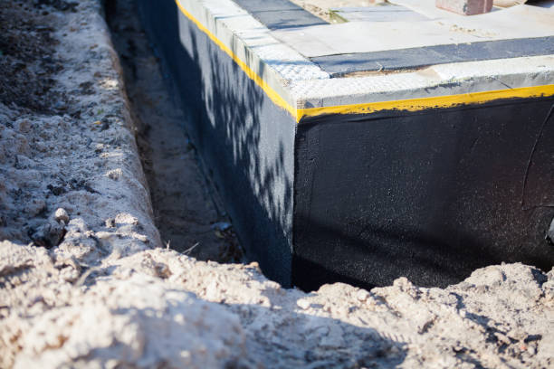 Professional Waterproofing technician working in Madison, MN